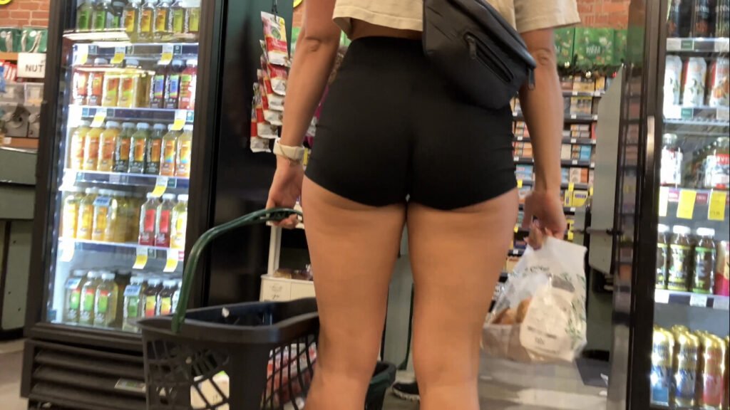 Pawg cheeks hanging out in supermarket with  spandex shorts